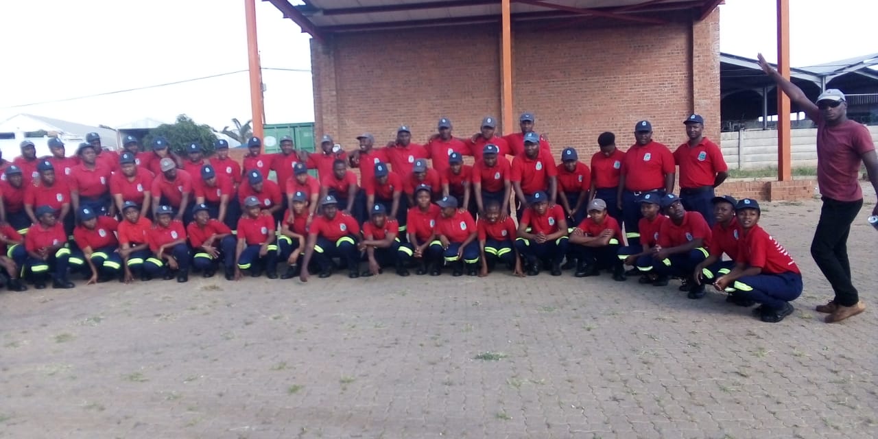 Large group of Vhutshilo Fire Academy learners in red and navy training uniforms