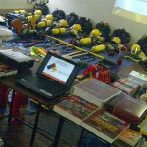 Firefighting equipment and course material laid out for a theory session